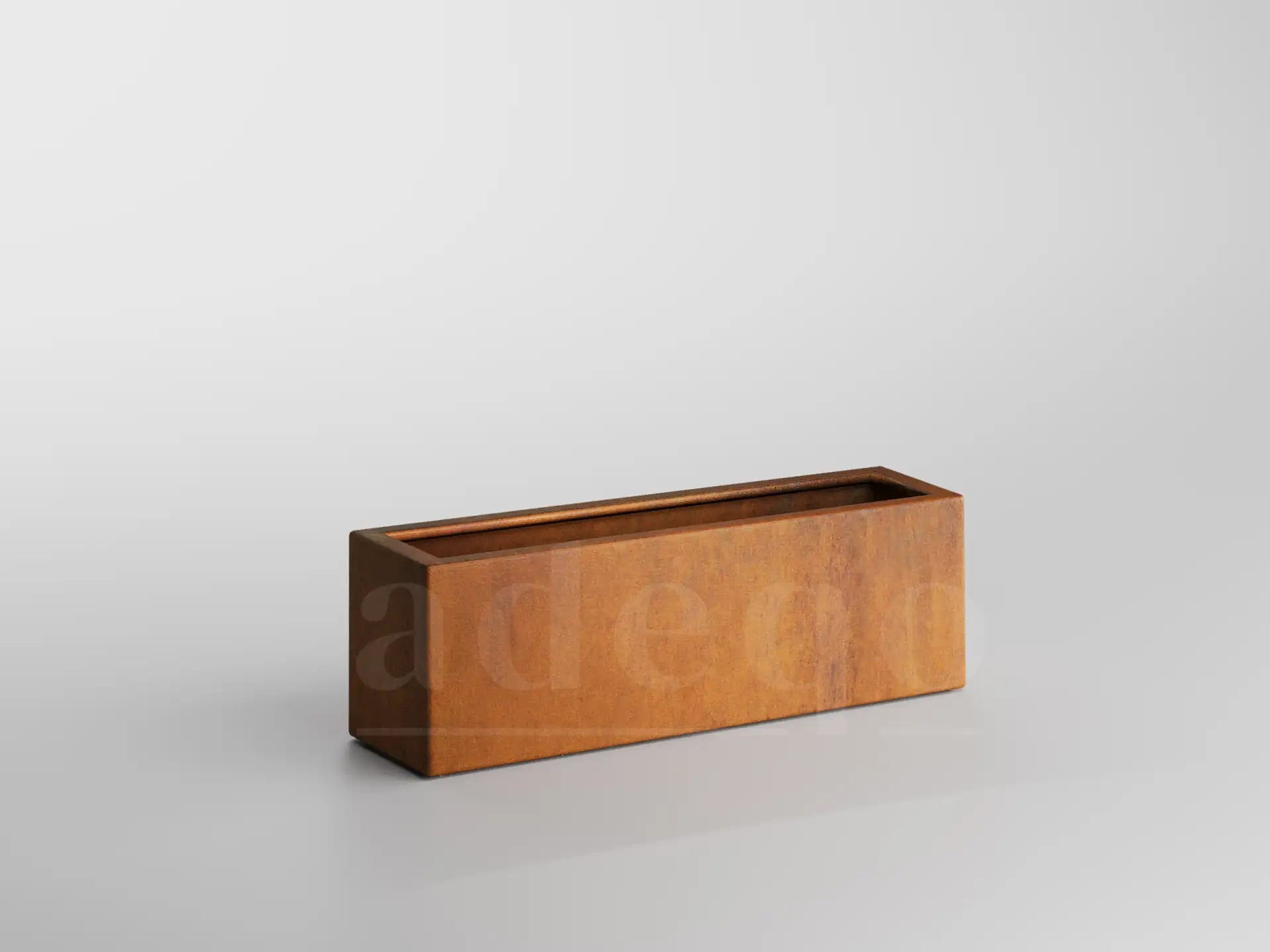 Lege cortenstalen plantenbak van Adeqo in rechthoekig model van 60x60x60 cm op een lichte achtergrond.