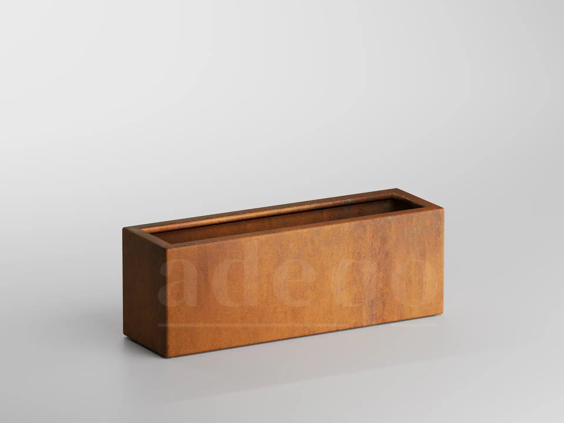 Lege rechthoekige Adeqo plantenbak van cortenstaal, formaat 100 x 30 x 35 cm, op een witte achtergrond.
