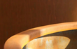 Close-up van de rand van een Adezz Conic Cortenstaal Plantenbak Rond met bodem, detail van het cortenstaal materiaal.