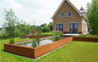 Adezz vijver van cortenstaal, groot rechthoekig model geplaatst in een landelijke tuin, zorgt voor rust en sfeer.