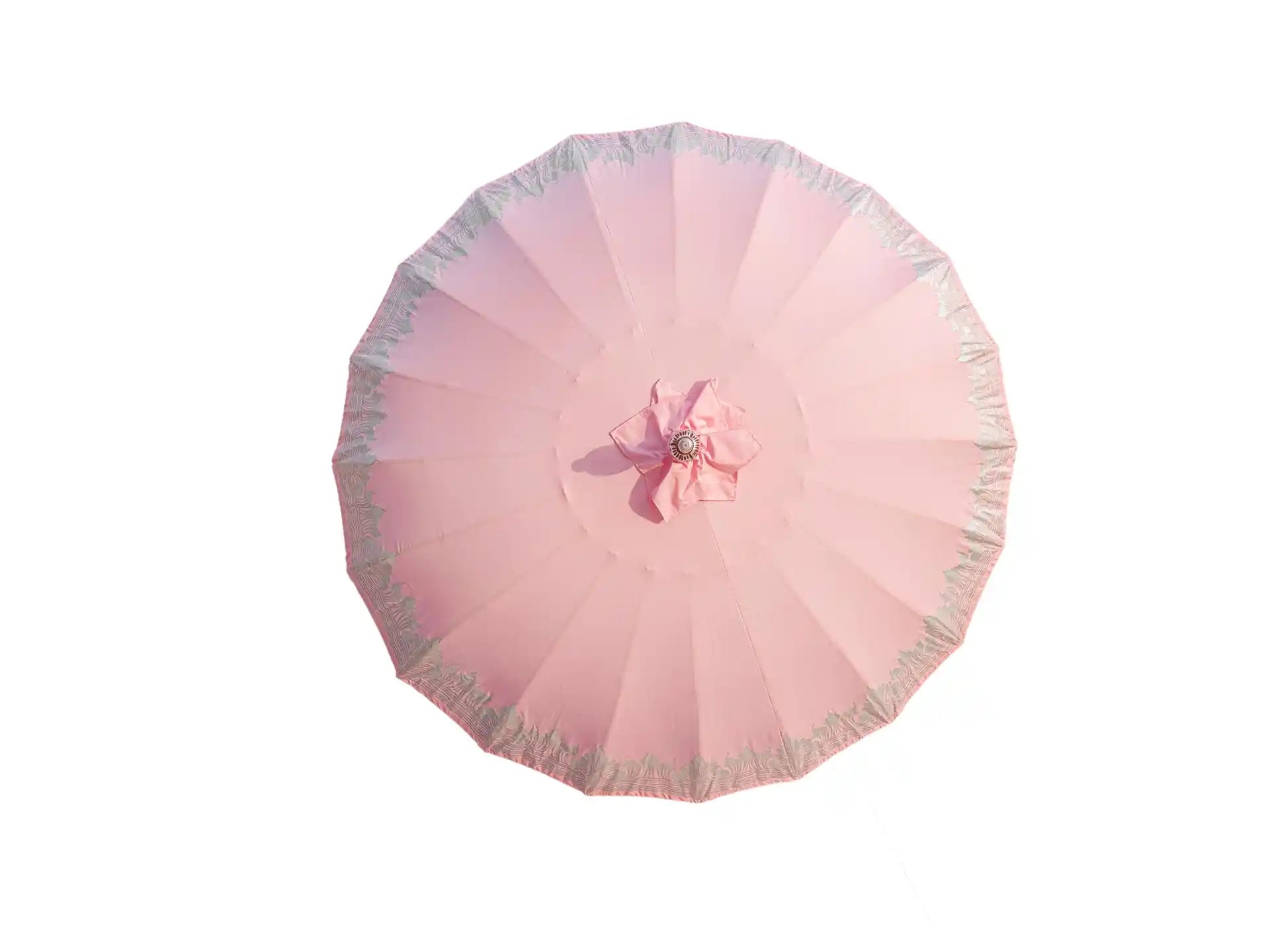 Bovenaanzicht van de roze Bali parasol van Todo Bien met decoratieve zilveren beschildering aan de rand.